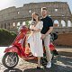 Couple with red Vespa & Colosseum
Dolce Vita vibes with a Vespa and the Colosseum behind